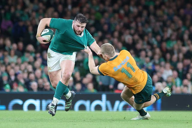 Ireland’s Robbie Henshaw is tackled by Australia’s Max Jorgensen during the autumn