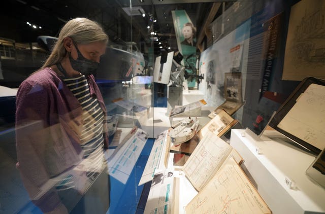 Victoria Ingles, senior curator at the National Museum of the Royal Navy, looks at a display during a press preview for The Night Hunters: The Royal Navy’s Coastal Forces at War exhibition at the Explosion Museum of Naval Firepower in Gosport, Hampshire 