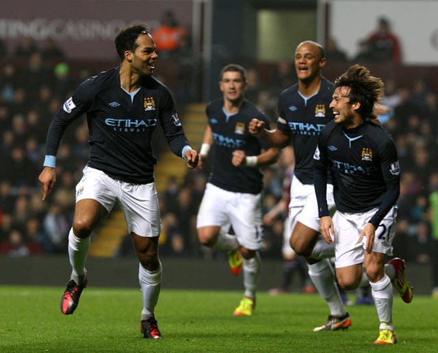 Lescott, left, sees similar signs between his relationship alongside Vincent Kompany, second right, and Dias-Stones' partnership