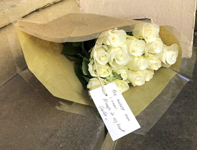 A bouquet of white roses outside the former residence of Dale Winton (Jamie Johnson/PA)