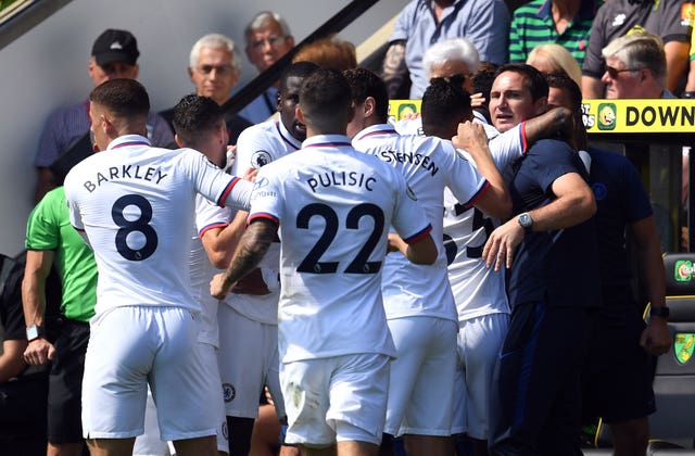 Chelsea players celebrate with manager Frank Lampard after Tammy Abraham''s first goal