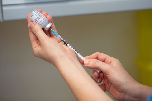 A nurse preparing the Moderna Covid-19 vaccine (Jacob King/PA)