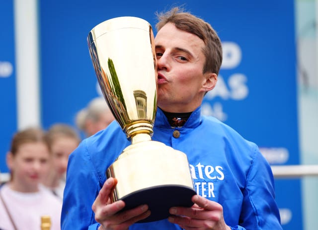 William Buick kisses the trophy after Ruling Court's victory