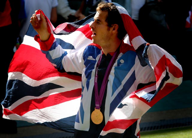 Andy Murray celebrates with the Union Jack and his Olympic gold at London 2012