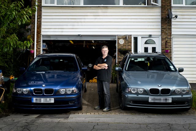 Paul Robins with his vehicles