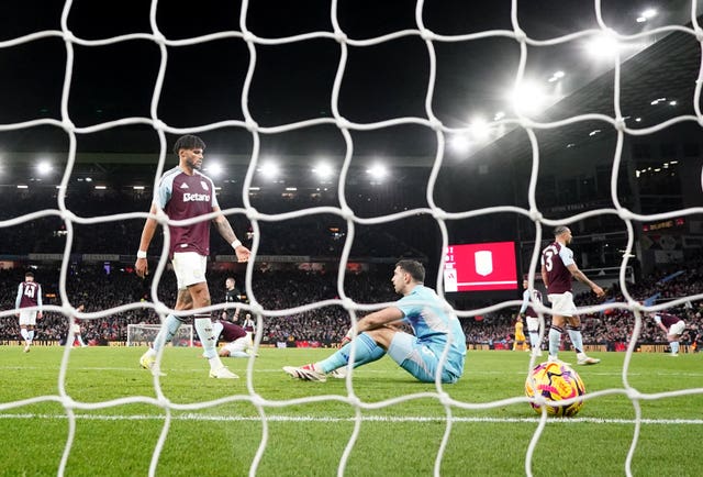 Aston Villa’s Tyrone Mings and goalkeeper Emiliano Martinez after conceding their second goal