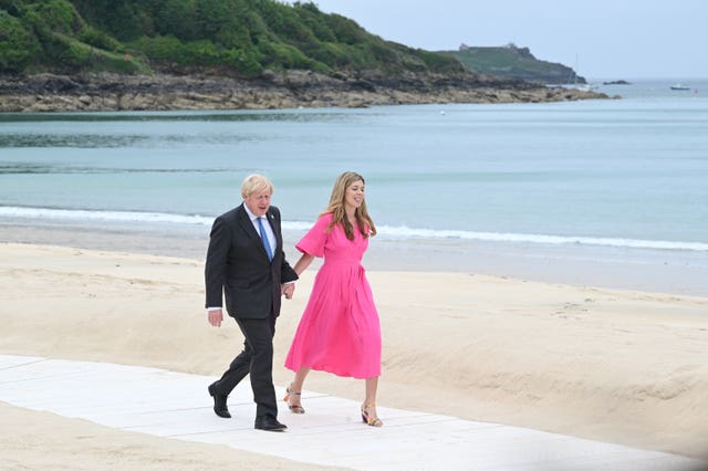 Prime Minister Boris Johnson and Carrie Johnson arrive for the leaders' official welcome and family photo during the G7 summit in Cornwall