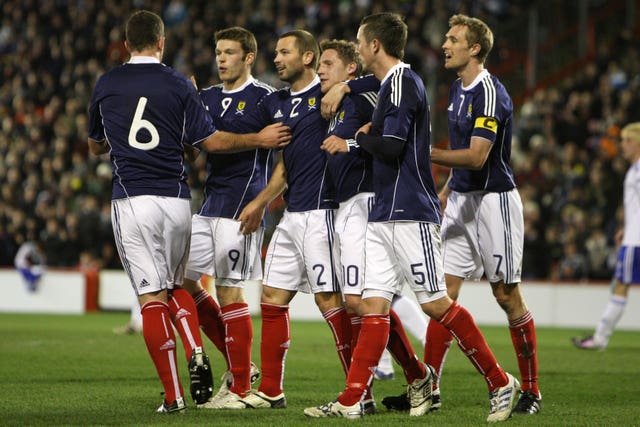 Kris Commons, centre, celebrates scoring against the Faroes in 2010