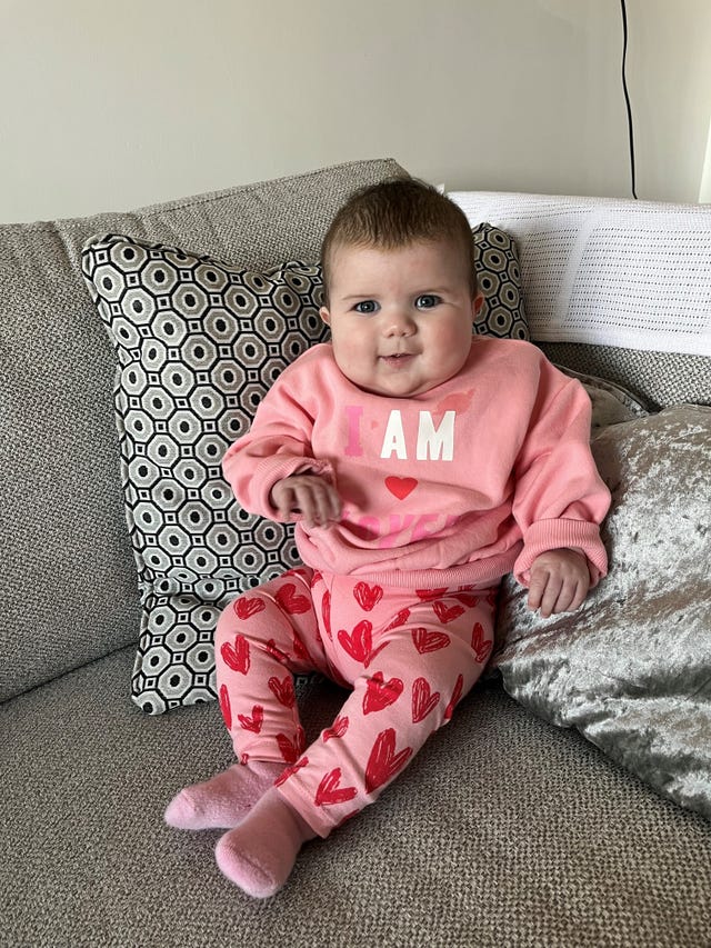 Baby Mabli Cariad Hall in a pink outfit 