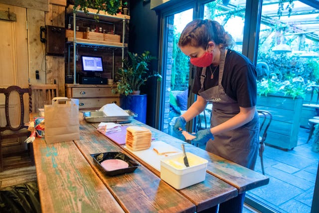 Helen Manning prepares sandwiches at The Watering Can, in Greenbank Park, Liverpool