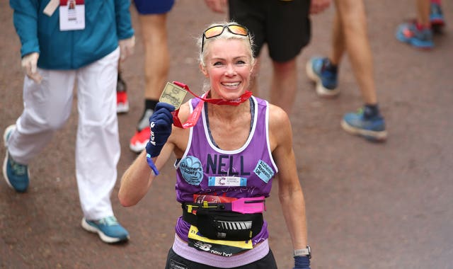 Nell McAndrew poses with her medal