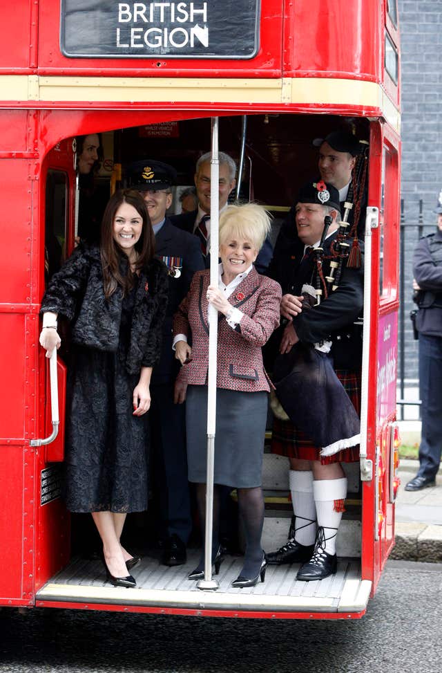 Barbara Windsor on a 1960s Routemaster bus