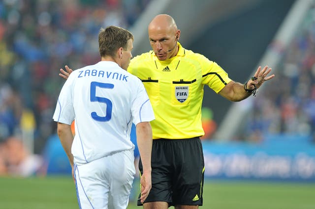 Match referee Howard Webb disciplines Slovakia’s Radoslav Zabavnik (left) 