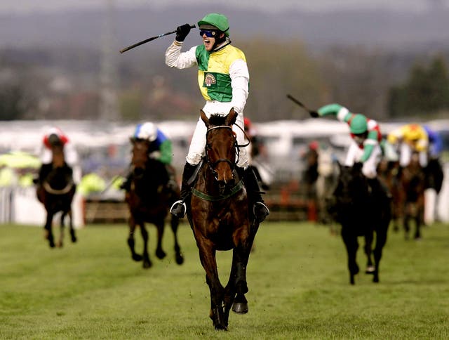 Ruby Walsh celebrates winning his second Grand National aboard Hedgehunter