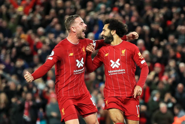 Mohamed Salah, right, celebrates with fellow goalscorer Jordan Henderson against Tottenham