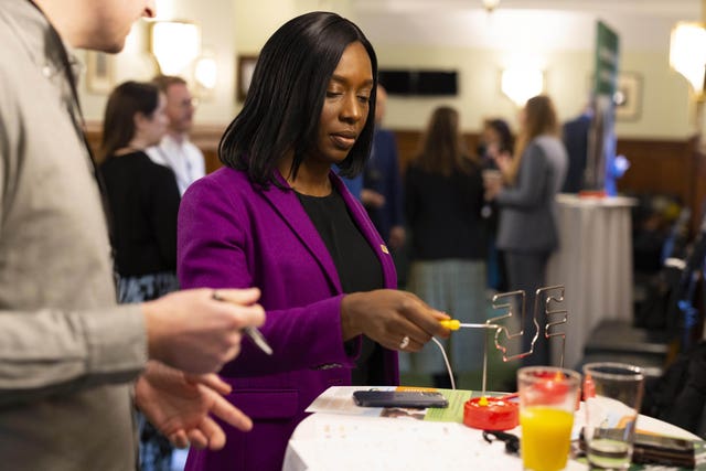 Florence Eshalomi uses a tool to play a game