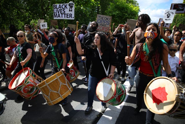 People march in central London after attending a Black Lives Matter rally in Hyde Park