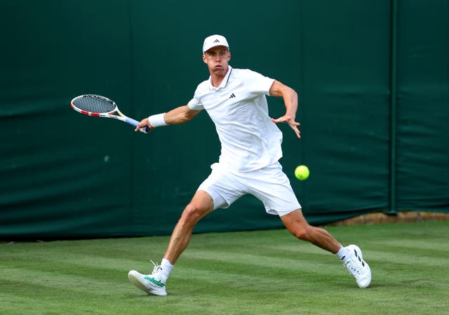 Jan Choinski returns a ball during his win at Wimbledon 