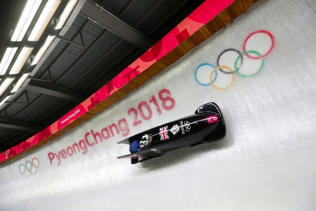 Great Britain’s Mica McNeill (pilot) and Mica Moore compete in the women's bobsleigh at the Olympic Sliding Centre
