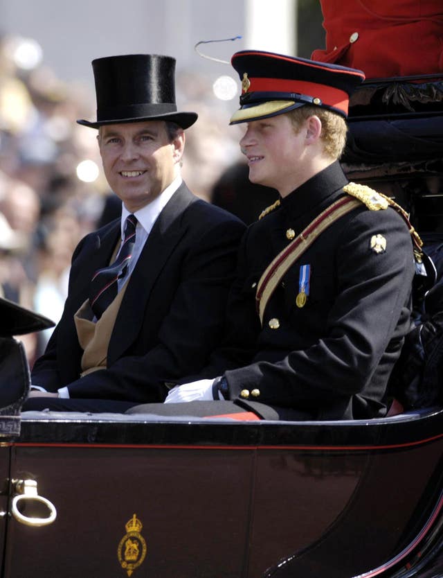 Harry sits in a carriage with the then-Duke of York (PA)