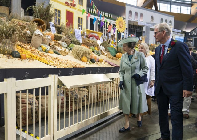 The Princess Royal views a product at the Districts Exhibition during a visit to open the Royal Agricultural Society of New South Wales Bicentennial Sydney Royal Easter Show in Sydney
