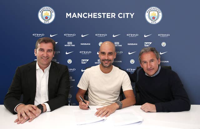 Pep Guardiola signs contract