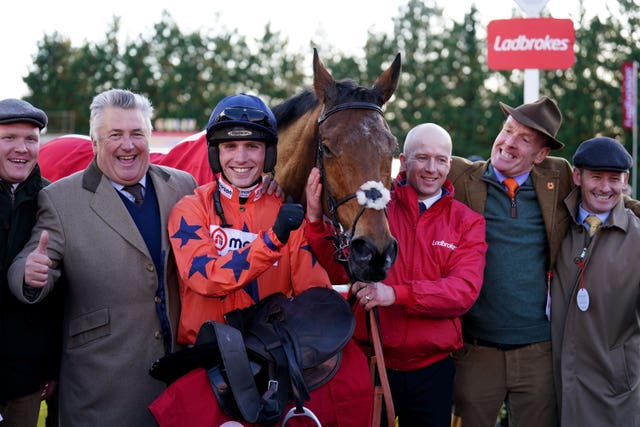 Paul Nicholls (left), Harry Cobden (centre left) and owner Bryan Drew (second right) 