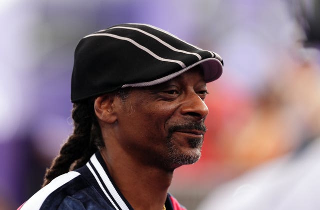 Snoop Dogg wearing a flat black cap