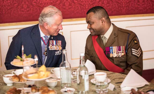 Charles talks with Victoria Cross recipient Johnson Beharry (Richard Pohle/The Times via PA)