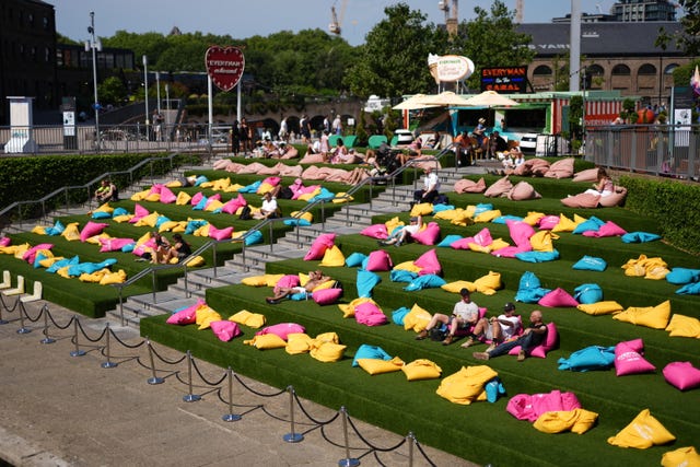 People sit on colourful beanbags