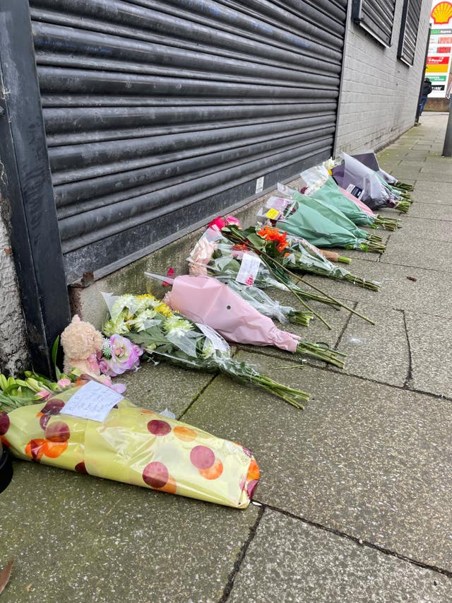 Flowers are left outside the Hessle Road branch of Legacy Independent Funeral Directors in Hull (Dave Higgens/PA)
