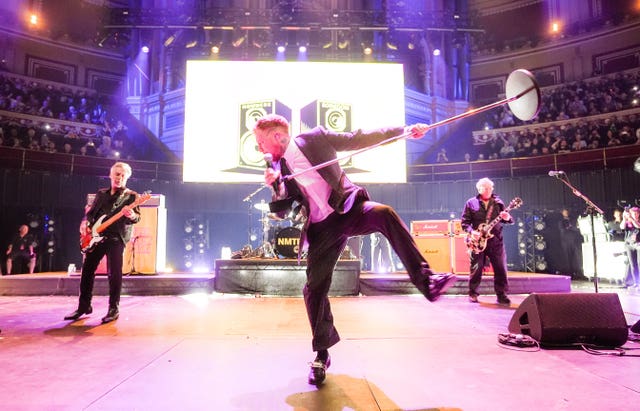 The Sex Pistols performing on stage 