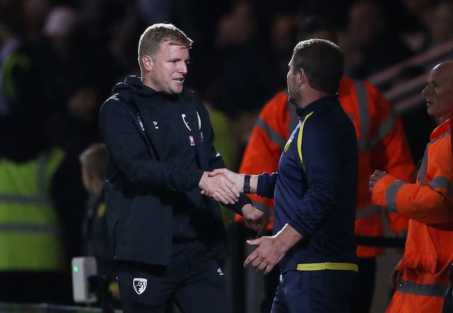 Bournemouth manager Eddie Howe shakes hands with Burton boss Nigel Clough