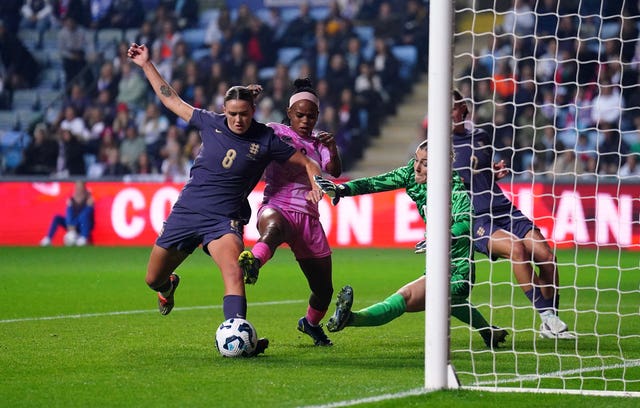 England's Grace Clinton, left, prevents Hildah Magaia scoring for South Africa