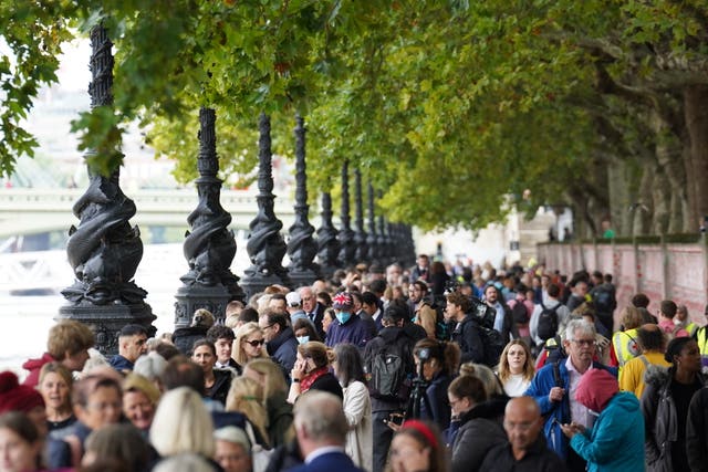 People join the queue to view the Queen lying in state