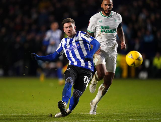 Josh Windass scores his second goal in Sheffield Wednesday's victory over Newcastle (Nick Potts/PA).