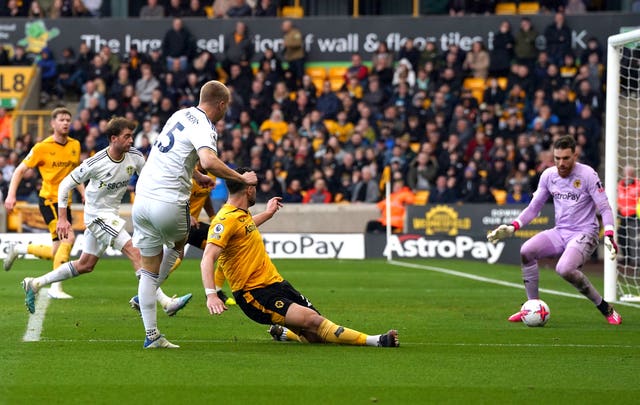 Rasmus Kristensen, centre-left, scores Leeds' third goal