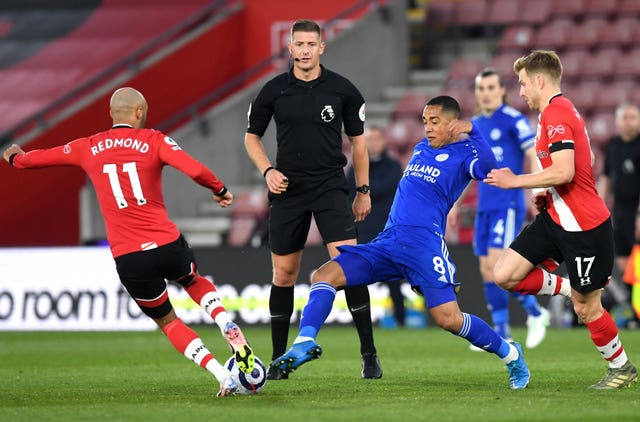 Leicester's Youri Tielemans (centre) in action