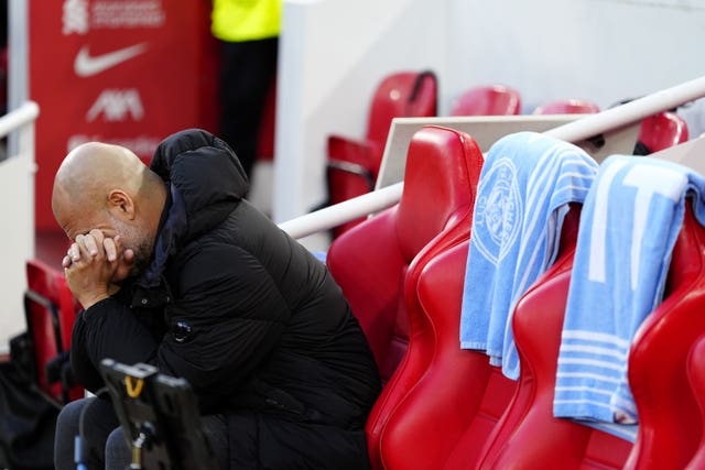 Pep Guardiola puts his head in his hands