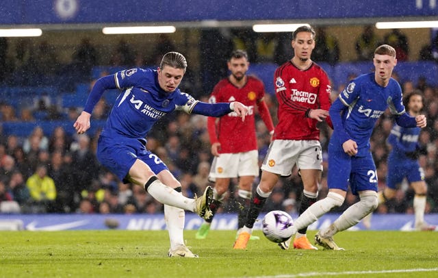 Chelsea’s Conor Gallagher, left, shoots at goal against Manchester United