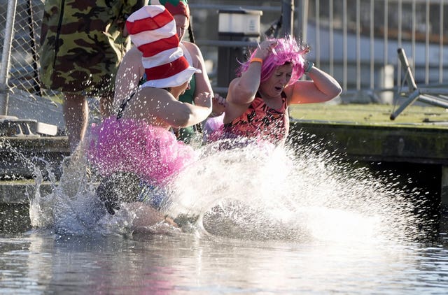 Two women in fancy dress in the water