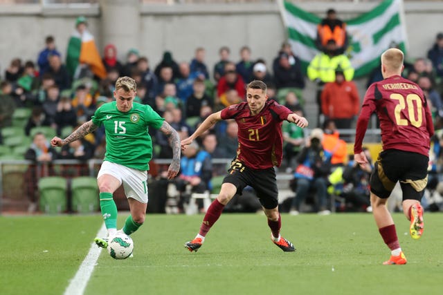 Sammie Szmodics, left, plays a pass under pressure from Belgium's Timothy Castagne