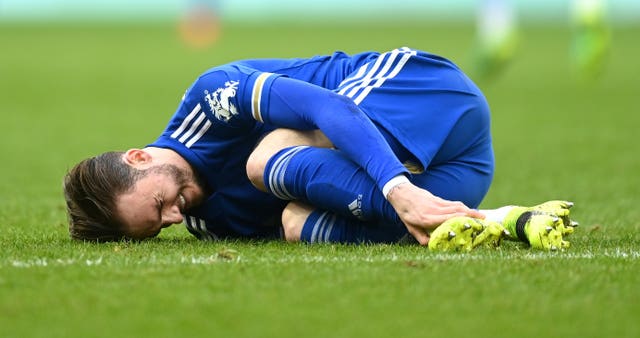 James Maddison clutches his ankle during Leicester''s win against Aston Villa