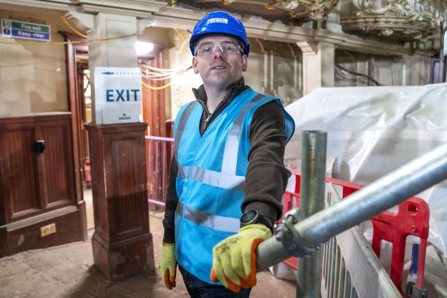Scottish Conservative leader Douglas Ross in a blue construction jacket and hard hat during a visit to the Kings Theatre, Edinburgh, which is undergoing refurbishment
