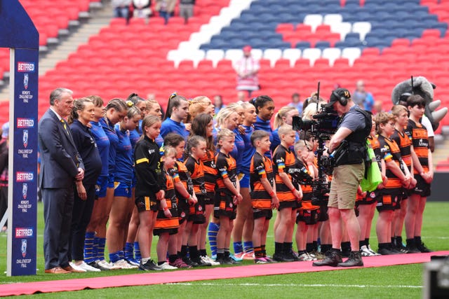 Leeds Rhinos women's players undertake a minute's silence in honour of Rob Burrow