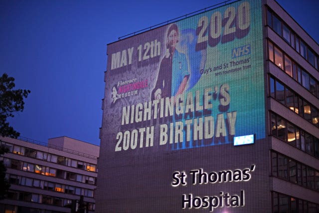 An image of Florence Nightingale is projected on to Guy’s and St Thomas’ hospital in London