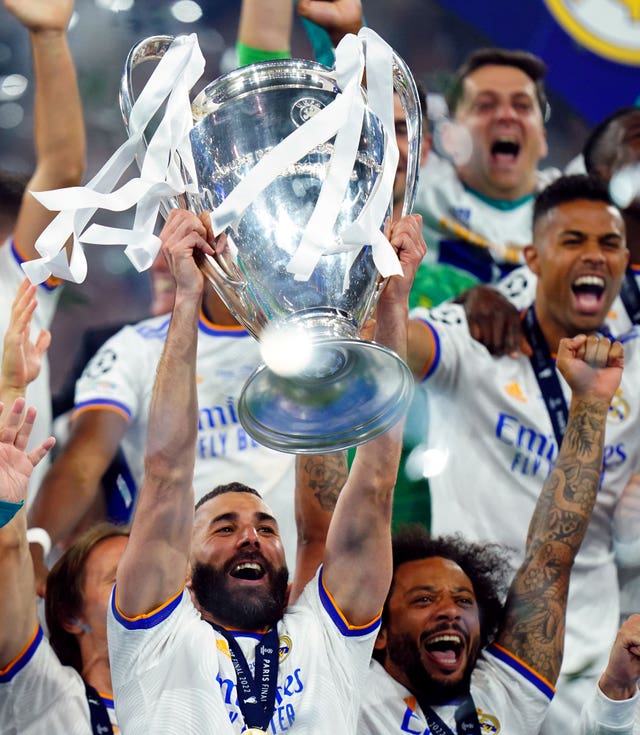 Real Madrid's Karim Benzema lifts the trophy after winning the UEFA Champions League Final in 2022