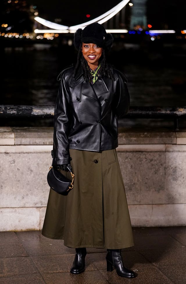 Little Simz attends the Burberry show at 1 Old Billingsgate Walk, London, during London Fashion Week 