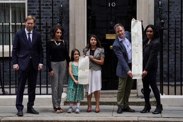 Gabriella and Richard Ratcliffe and supporters hand in a petition to 10 Downing Street to mark the 2,000th day of Ms Zaghari-Ratcliffe's detention