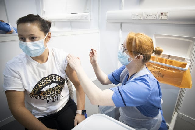 A woman being vaccinated